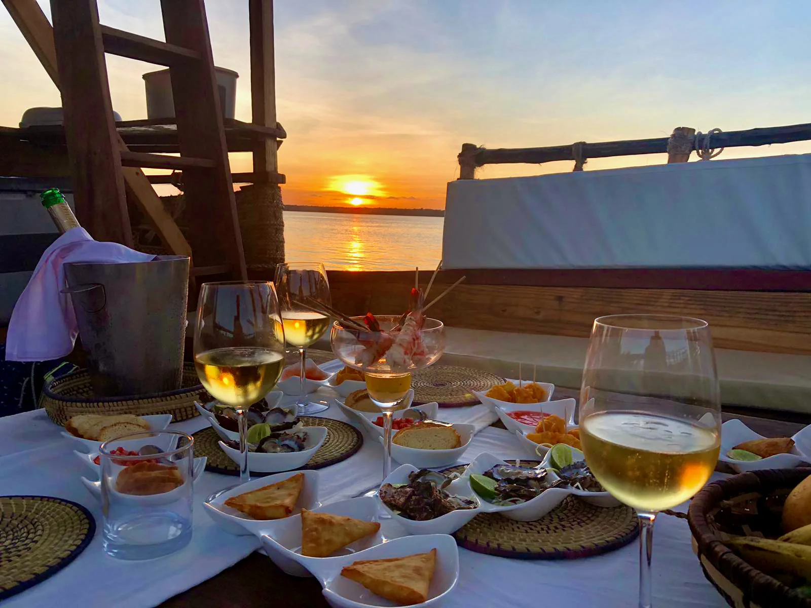 A table laid on the dhow's deck for the sunset aperitivo